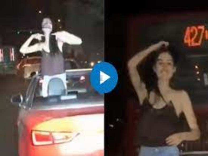 VIDEO: खुली कार पर खड़े होकर लड़की ने किया डांस, ट्रैफिक में फंसे लोग देखते रहे तमाशा
